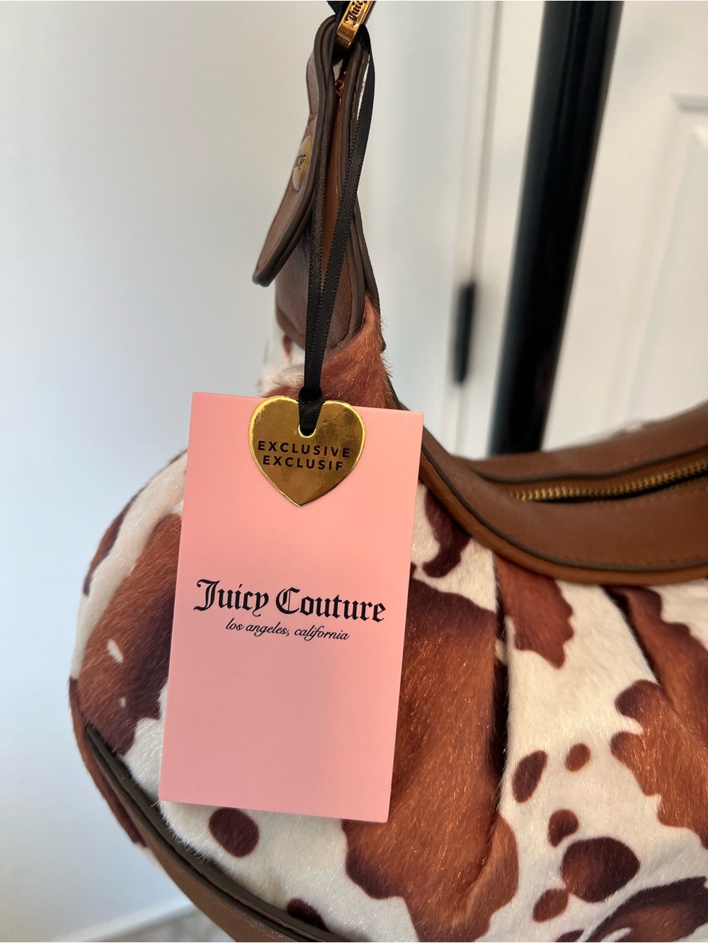 Juicy Couture Brown & White Cowhide Print Shoulder Bag with Heart Charm & Bow - Picture 3 of 6